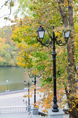 A beautiful lantern against the backdrop of an autumn park and river.