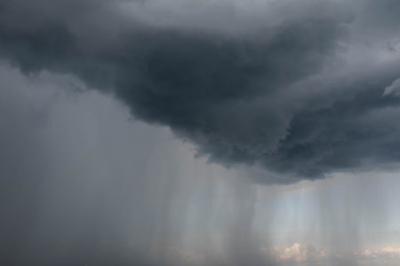 Blurred image of a thundercloud and rain. Bad weather concept.