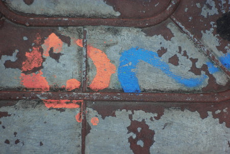 Paint on a metal surface. paint cracked from time to timeの写真素材