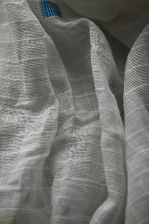 white fabric texture useful as a background - soft focus with vignetteの写真素材