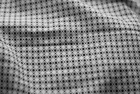Texture, background, pattern, black and white fabric with a pattern of small circles.の写真素材