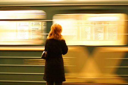 woman and subway train