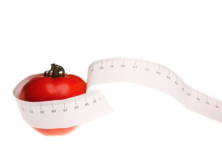 Tomato with measuring tape on white backgroundの写真素材