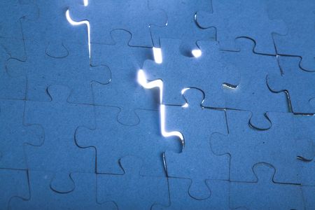 close up cracked puzzle wall with backlightの写真素材