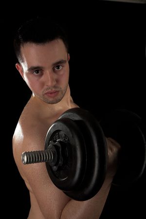 Young handsome man on black isolated background