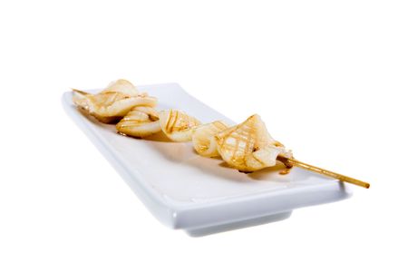 white grilled fish isolated on the whiteの写真素材