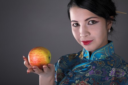 young beauty japanese girl with red appleの写真素材