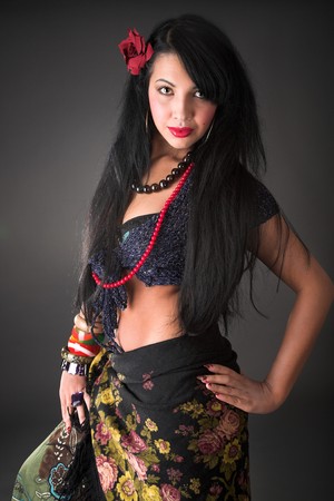 young beauty gipsy girl on the grey backgroungの写真素材