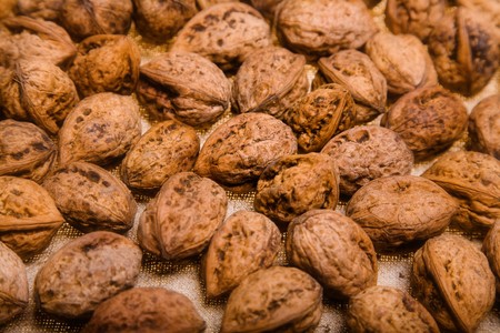 close up photo of walnut - textured background 