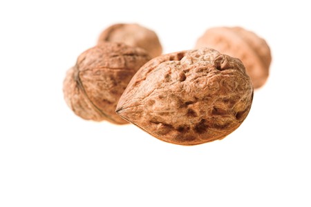 whole walnuts isolated on white. Selective focus 