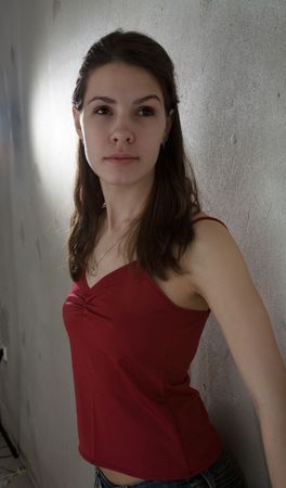 beauty girl in red shirt looking pronouncedlyの写真素材