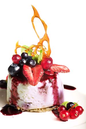 nice cheesecake with berries isolated on whiteの写真素材