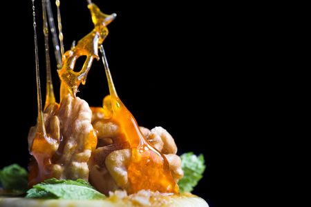 nice cheesecake on the plate isolated on blackの写真素材