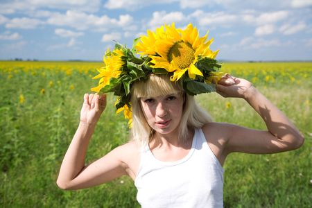 freckled yuong woman in sunflower diademの写真素材