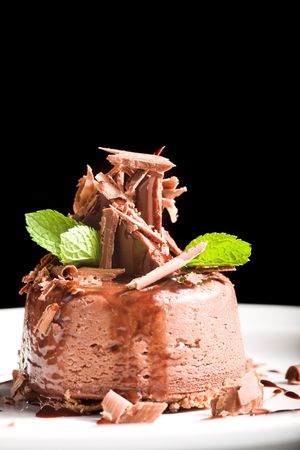 nice cheesecake on the plate isolated on blackの写真素材