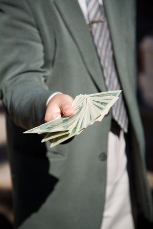 businessman hand with lot of moneyの写真素材