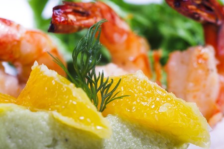 shrimps with citrus and greens isolated on whiteの写真素材
