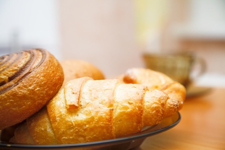 pastry and tea cup on the tableの写真素材