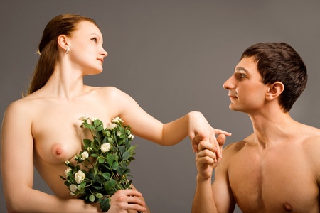 beauty woman and her admirer isolated on grayの写真素材