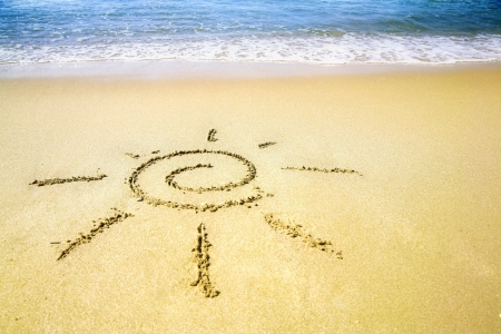 Sun pictured on the summer sandy beachの写真素材