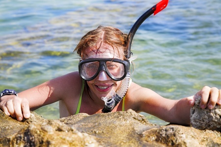 young beauty woman swimming in diving maskの写真素材