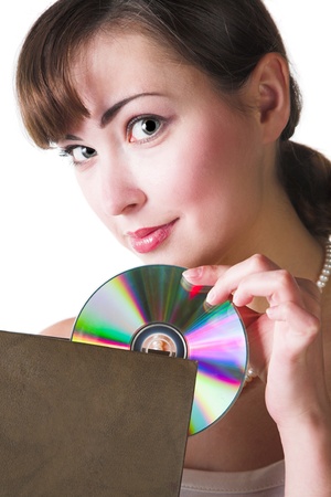 woman holding big book and compact disk の写真素材