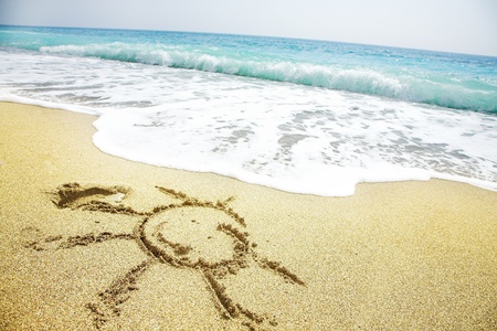 Sun pictured on the summer sandy beachの写真素材