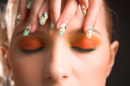 beauty woman with brightly makeup isolated on blackの写真素材