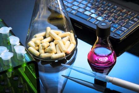 flask with capsule on the mirror table 