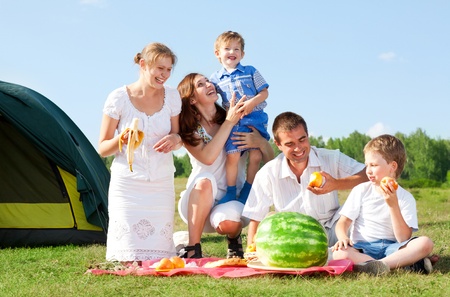 happy family have a picnic outdoorの写真素材
