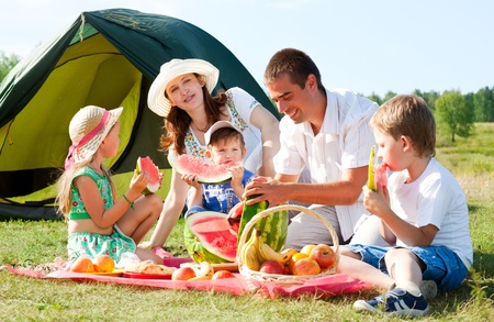 happy family have a picnic outdoorの写真素材