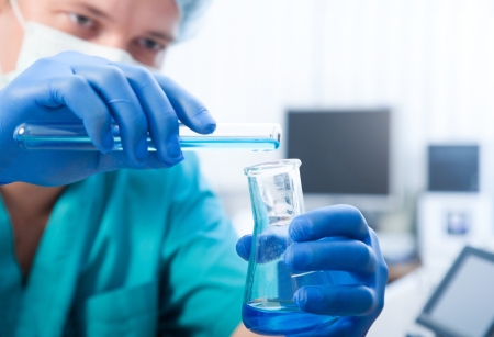 scientist doing chemical test in modern laboratoryの写真素材