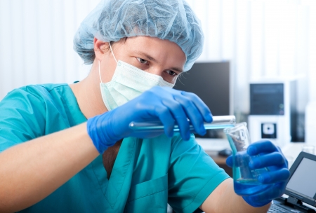 scientist doing chemical test in modern laboratoryの写真素材