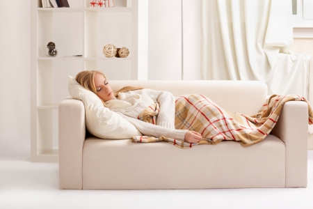 beauty girl sleeping on the sofaの写真素材