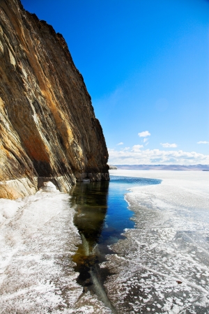 cliffs at frozen baikal lake in winter の写真素材