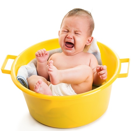 crying boy isolated on whiteの写真素材