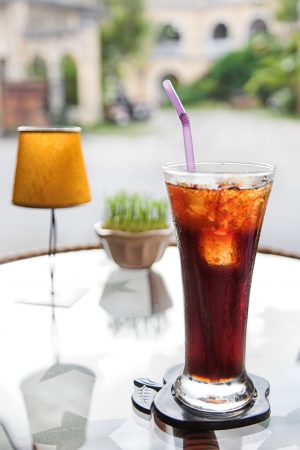 Fresh cola drink on the tableの写真素材