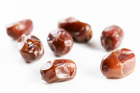 Close-Up Of Dry Date Fruit Over White Background 