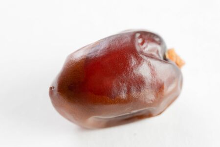 Close-Up Of Dry Date Fruit Over White Background 