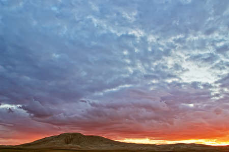 Evening cloudy sky over the sand dunes. Western Mongolia, Mongol-Els desert.