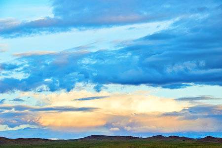 Evening cloudy sky over the sand dunes. Western Mongolia, Mongol-Els desert.の写真素材