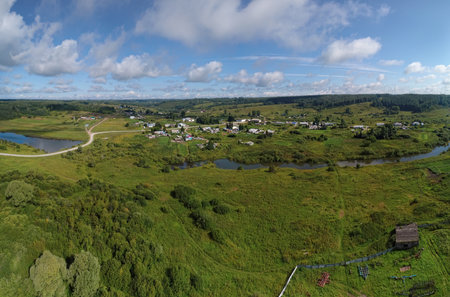 Aerial landscape with Siberian village on small riverの写真素材
