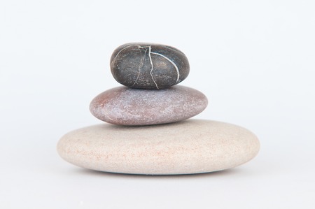balanced zen stones on white backgroundの写真素材