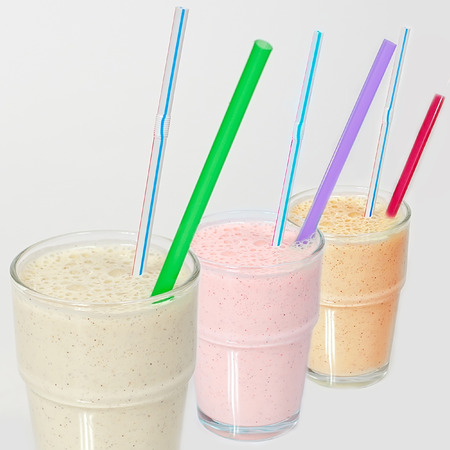 milkshake in a glass with a straw on a white background6の写真素材