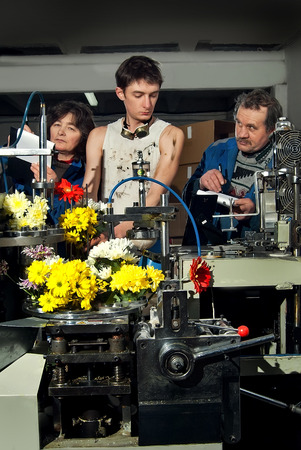 Flowers on the production of machines at the factory with the control engineer