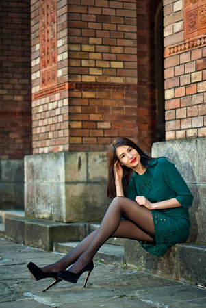 A beautiful girl walks around the city in the summer or in the fallの写真素材