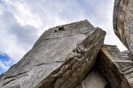 Betveen the houses at Machu Picchu, the sacred city of Incas, one of the New 7 Wonders of the World, Peruの写真素材