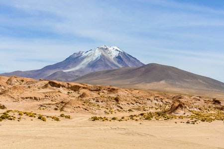 View of a volcano in the High Andean Plateau desert in Boliviaの写真素材