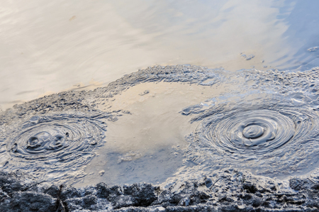 Mud pool in the wonderland of the Wai-o-tapu geothermal area, near Rotorua, New Zealand