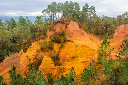 Colorful rocks made of ochre near the hilltop village of Rousillon, Provence, France